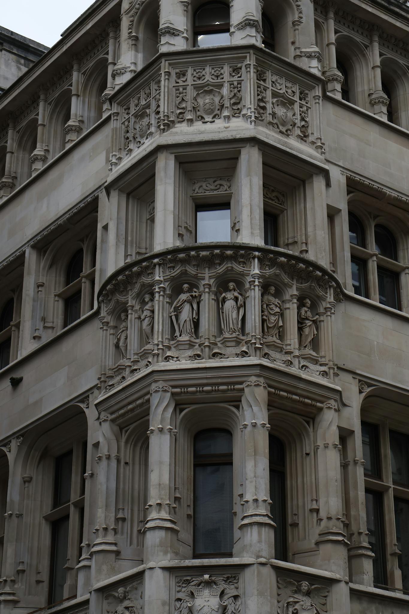 Intricate sculptural facade of a historic building in London, England, showcasing ornate architectural design.